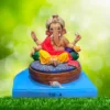 Ganpati Idol siting on Round Aasana