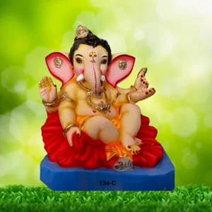 Bal Ganpati Idol sitting on Hibiscus